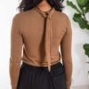Knotted High Neck in Brown by Table - Image 3