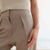 Pleated Trousers in Beige by Table - Image 5